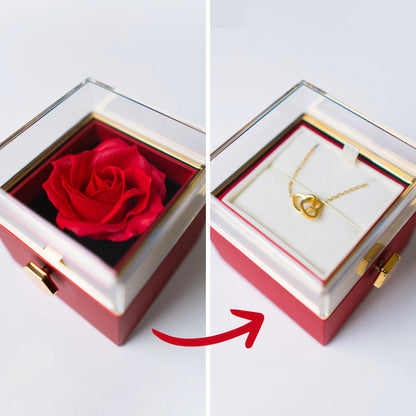 Boîte à bijoux rotative avec rose éternelle pivotant pour révéler un collier caché à l'intérieur.